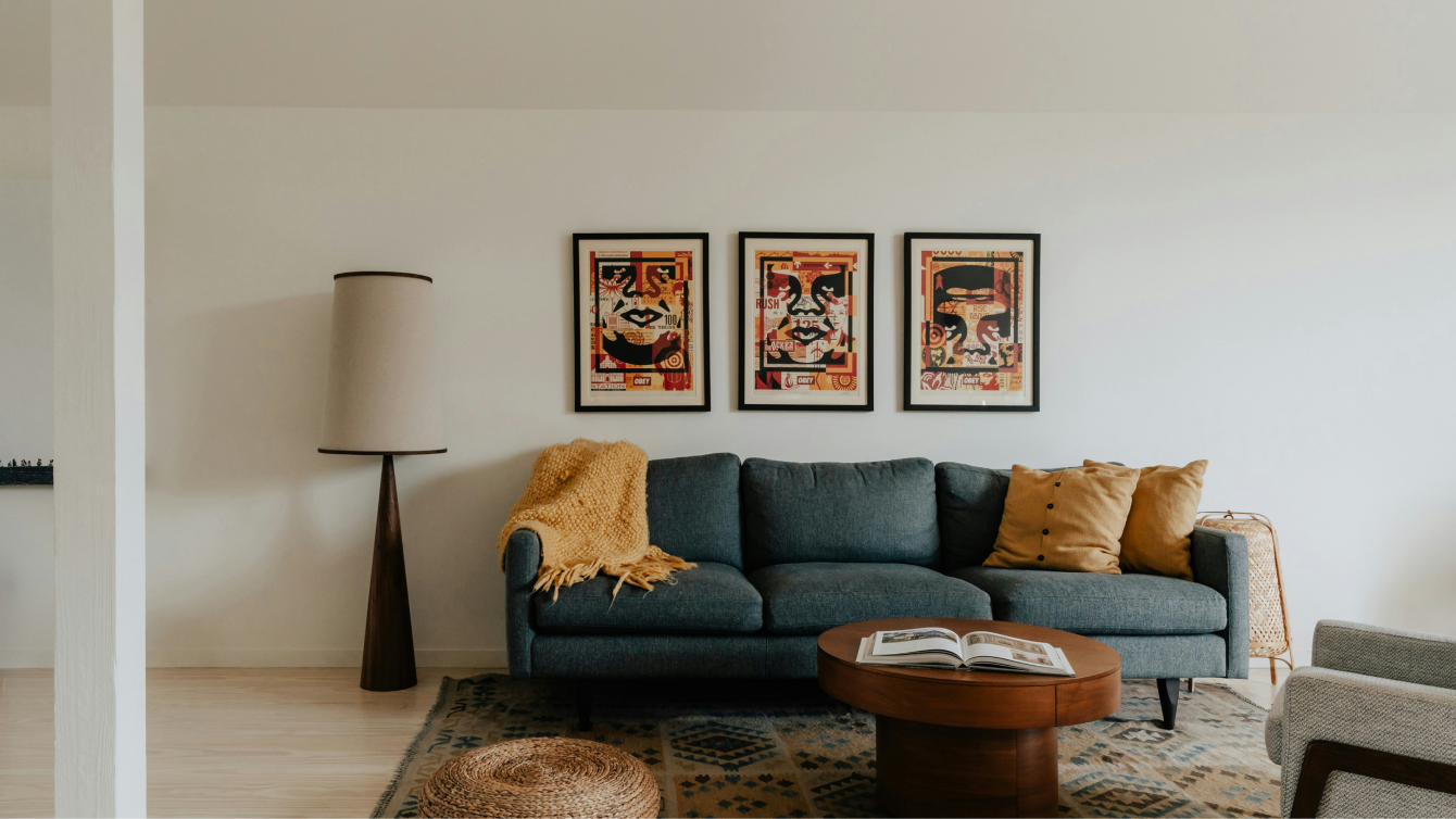 Modern living room interior with art gallery wall and mid-century sofa